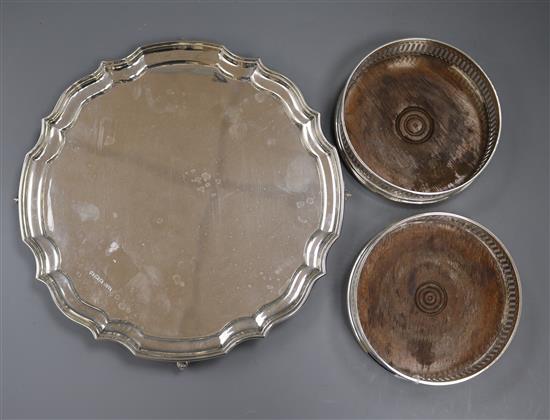 Two similar modern pierced silver bottle coasters and a silver salver, 16oz (salver)